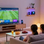 Family enjoying King365tv on a modern TV in a cozy living room.